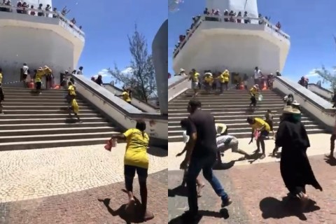 Devoto joga dinheiro para cumprir promessa na estátua do Padre Cícero e gera alvoroço